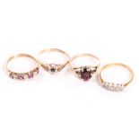 A group of four gem set rings, including a 9ct gold and single red stone example, an Art Deco period