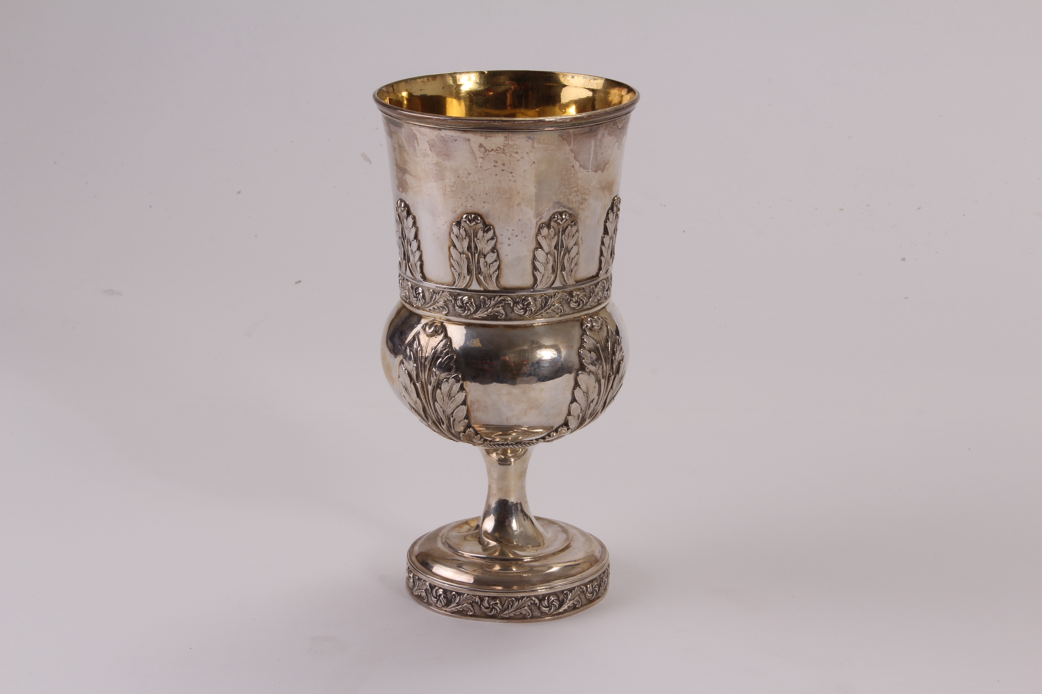 A George III silver chalice by Robert & Samuel Hennell, the thistle shaped vessel with raised leaf