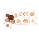 A collection of twelve interesting coins, including three George V lustre pennies and one half