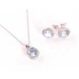 A 9ct gold and gem set earrings and necklace set, the cluster style pendant in white gold