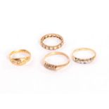 Two gold five stone rings, together with an eternity ring and an 18ct three stone diamond ring (4)