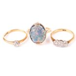 A vintage three stone diamond ring, together with a solitaire diamond ring, both marked 18ct, and an