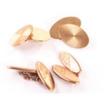 Two pairs of 9ct gold cufflinks, one pair with oval panels united by chain links having engraved