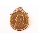 A 1979 South African Krugerrand in mount, the 1 oz fine gold coin, VF, in a 9ct gold pendant