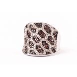 A modern gem set silver dress ring, marked TGGC, the large concave tablet set with leopard skin