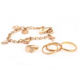 A 9ct gold charm bracelet and four gold ring, including the several charms to curb link chain, a 9ct