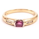 An 18ct gold and gem set ring, having an oval cut ruby on white torsion style mount, having three