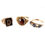 A 9ct gold and garnet gent's signet ring, together with a 9ct gold and ebony example, plus a