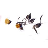 A pair of silver and amber table roses, the stems and petals in silver, with two different colour