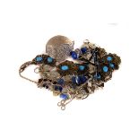 A group of Middle Eastern jewellery, including a lapis lazuli necklace and pendant, a large cuff