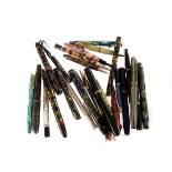 A collection of vintage fountain and other pens, including a Conway Stewart fountain pen and