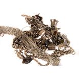 A small group of silver jewellery, comprising a charm bracelet, a heart shaped locket, chains,