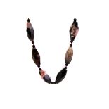 A hardstone bead necklace, the large faceted mottled stones also set with spherical beads