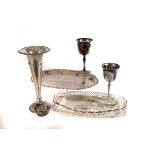 A collection of silver plated items, including cased sets of cutlery and flatware, a trumpet vase, a