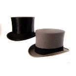 A Gentleman's black brushed silk top hat, together with a Herbert Johnson grey top hat, both with