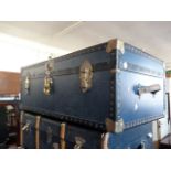 A Mossman blue travelling trunk, having brass fittings