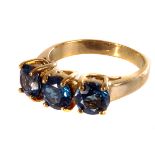 A 9ct gold and three stone blue zircon dress ring, the three round cut blue stones in separate