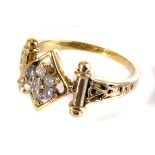 A Middle Eastern yellow metal and gem set ring, the stylish mount having brilliant cuts in a