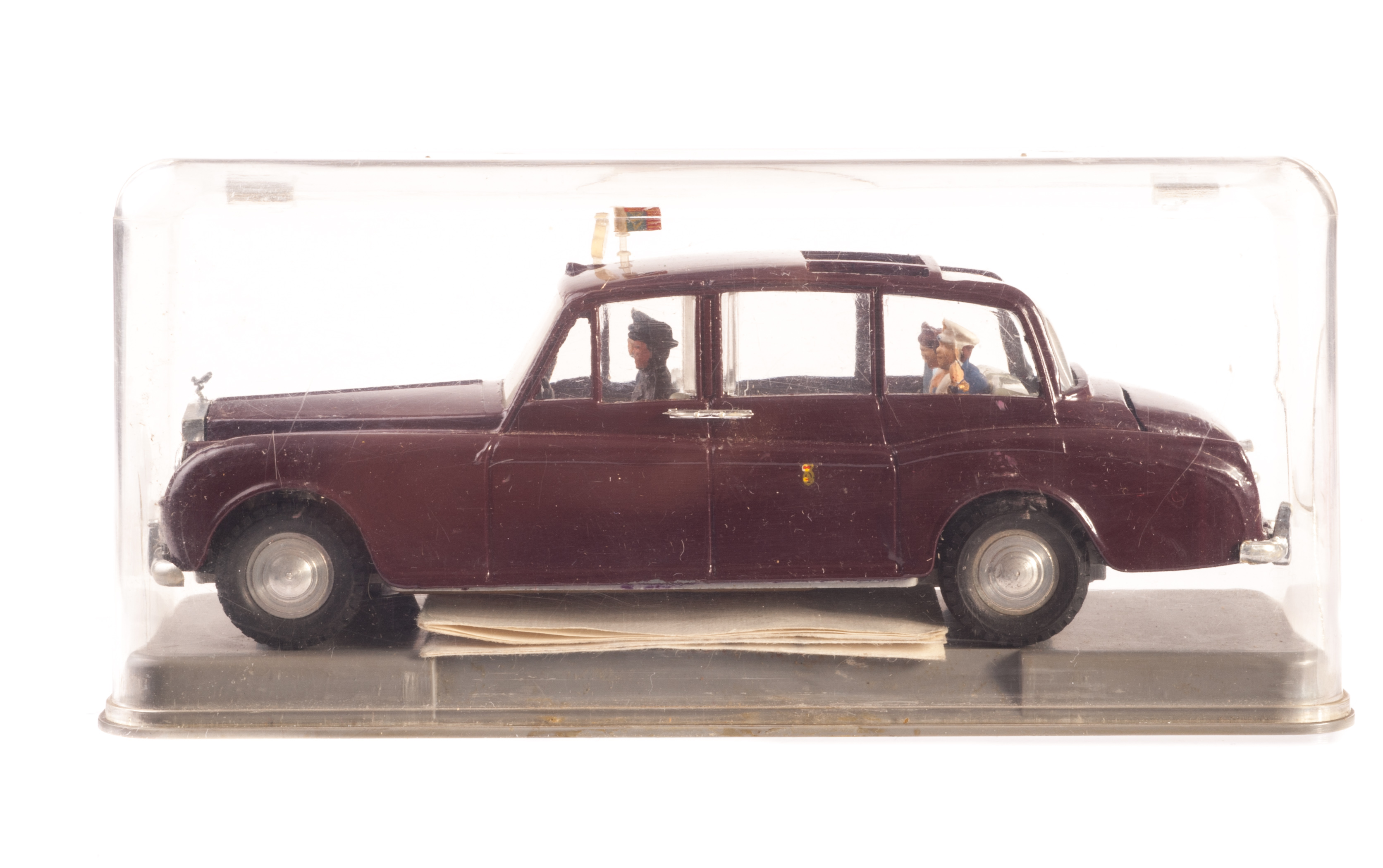 A Tri-ang Spot-On No.260 Royal Rolls-Royce Phantom V, maroon body, flag to roof, four figures, in