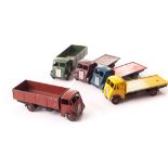 Dinky Toys 512 Guy Flat Truck, three examples, yellow cab and flatbed, black chassis, red hubs, dark