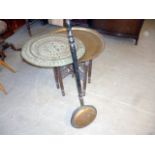 A Middle Eastern brass tray top table, together with another tray and a warming pan