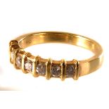 An 18ct gold half eternity ring, the seven brilliant cut stone set in 18ct golsd metal with raised