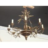 A pair of large wheat sheaf style wooden and plaster chandeliers, having eight branch design amongst