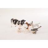 An assortment of six Beswick ceramic animal figures, comprising a cow, a dalmatian, a bulldog, a