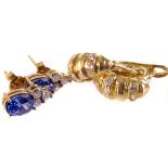 A pair of 9ct gold sapphire and diamond stud earrings, the oval cut sapphire above three brilliant