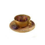 A Royal Worcester cabinnet cup and saucer, having hand painted fruit design with signature