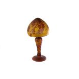 A Gallé style glass lamp and shade, the amber coloured lamp and shade with raised maroon leaf and