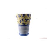 A decorative Shelley ceramic vase, the top half decorated with blue floral design, below loght