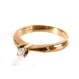 A 9ct gold diamond ring, the small brilliant cut diamond in high claw mount setting, size N,