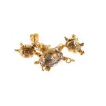 A 750 marked gold and mixed metal tortoise pendant, having ruby eyes and diamonds to shell, AF, on