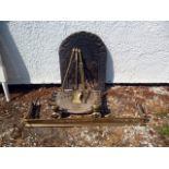 A group of fireplace items, including a pair of Regency brass griffin form fire dogs, a cast iron