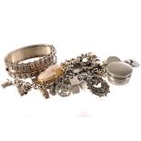 A collection of various silver jewellery, including a charm bracelet, a decorative bangle, a gem set