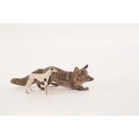 A cold painted bronze figure of a creeping fox, together with a lead painted figure of a