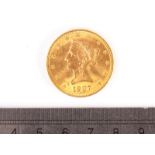 A US Ten Dollar gold coin, dated 1907, VF, approx 16.7g