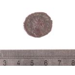 A Victorinus copper coin, 3rd century, head facing right, the reverse robed figure holding standard,