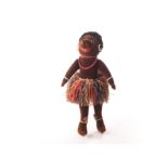 Unusual early British velvet black doll in native dress, 1920s, of brown velvet, black boot button