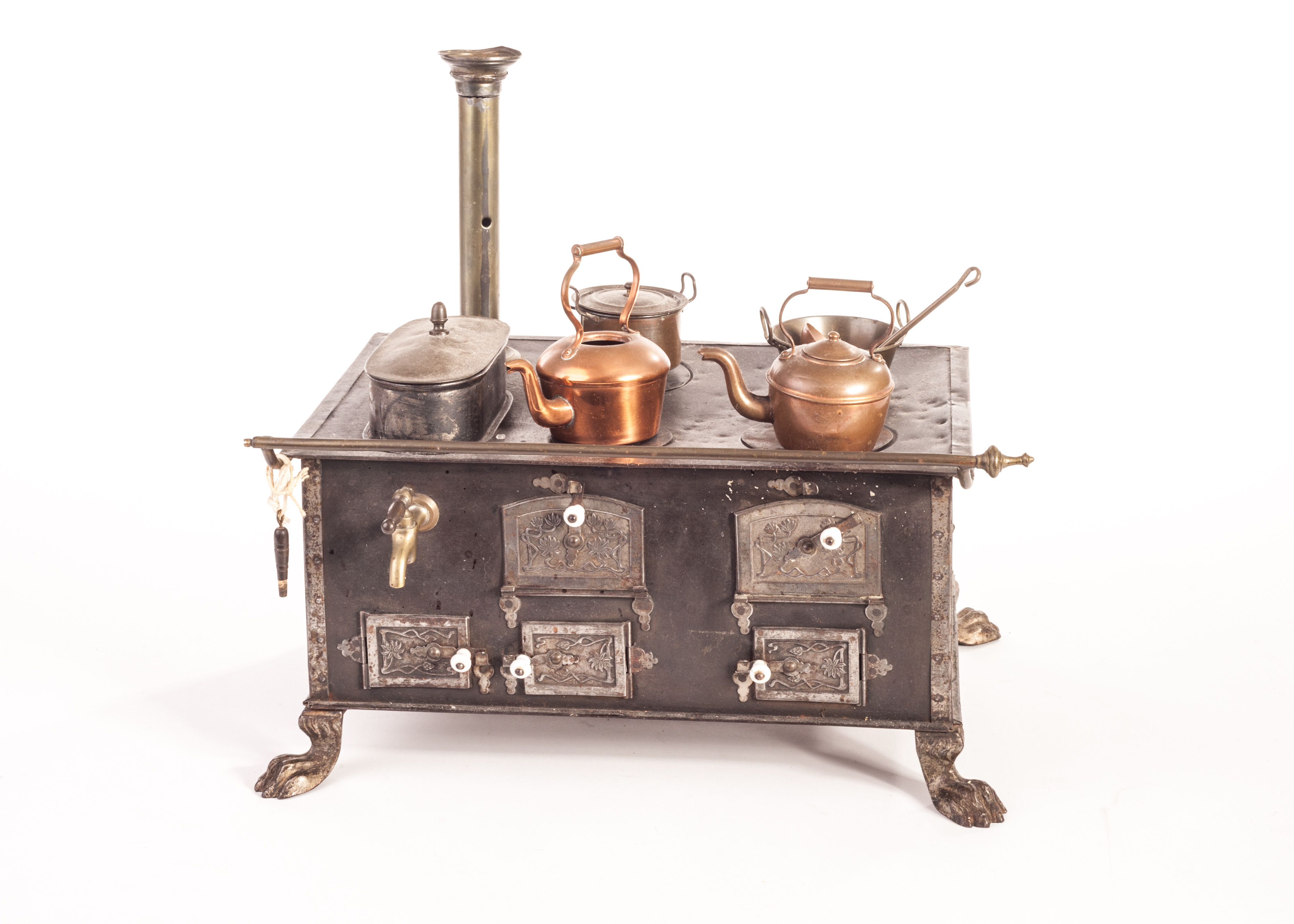 A German steel cooking range, early 20th century, with five polished steel Art Noveau oven doors