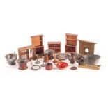 Dolls kitchen items: a copper coffee pot and kettle (missing lids); a red painted chamber stick; a