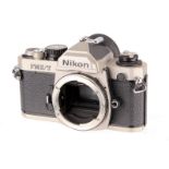 A Nikon FM2/T SLR Body, titanium, serial no. T9001783, body, G-VG, shutter fires but mirror locks up