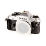 A Nikon FG SLR Body, chrome, serial no. 8873828, body, VG, shutter working, in maker’s box with