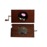 Mahogany-mounted Magic Lantern Slides: rotary opening flower slide, hand painted, G, and rotating