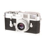 A Leica M3 DS Rangefinder Camera, 1956, chrome, serial no. 843936, with Leitz Elmar f/2.8 50mm lens,