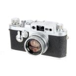 A Leica IIIg Rangefinder Camera, 1959, chrome, serial no. 956490, with Leitz Summicron f/2 50mm