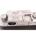 A Leica IIIb Rangefinder Camera, chrome, serial no. 290087, with Leitz Elmar f/3.5 50mm lens,