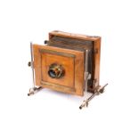 An Unmarked French Bi-Rail Mahogany Camera, 5x7”, with 13 x 18 Extra Rapide brass lens, in