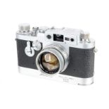 A Leica IIIg Rangefinder Camera, 1959, with Leicavit, chrome, serial no. 969052, with Leitz